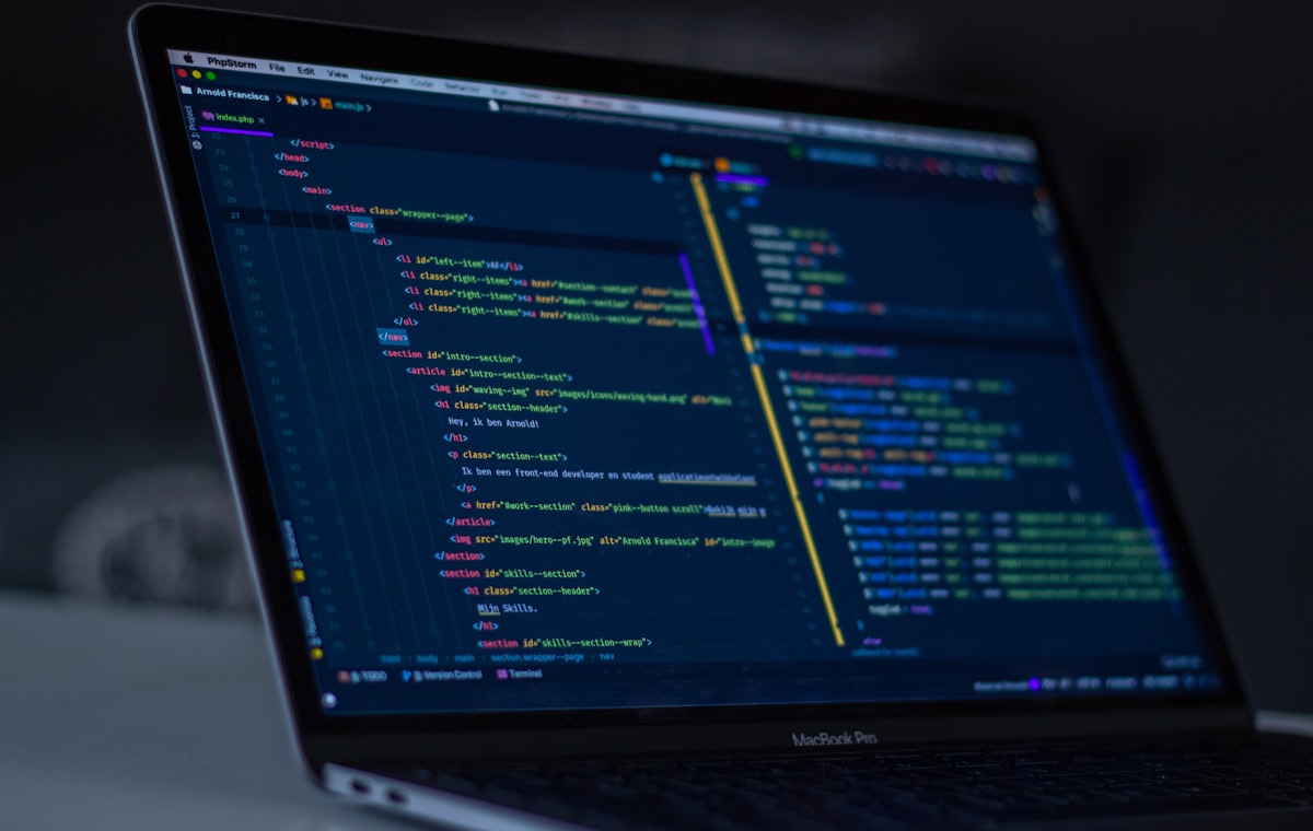 Software code displayed on a laptop screen