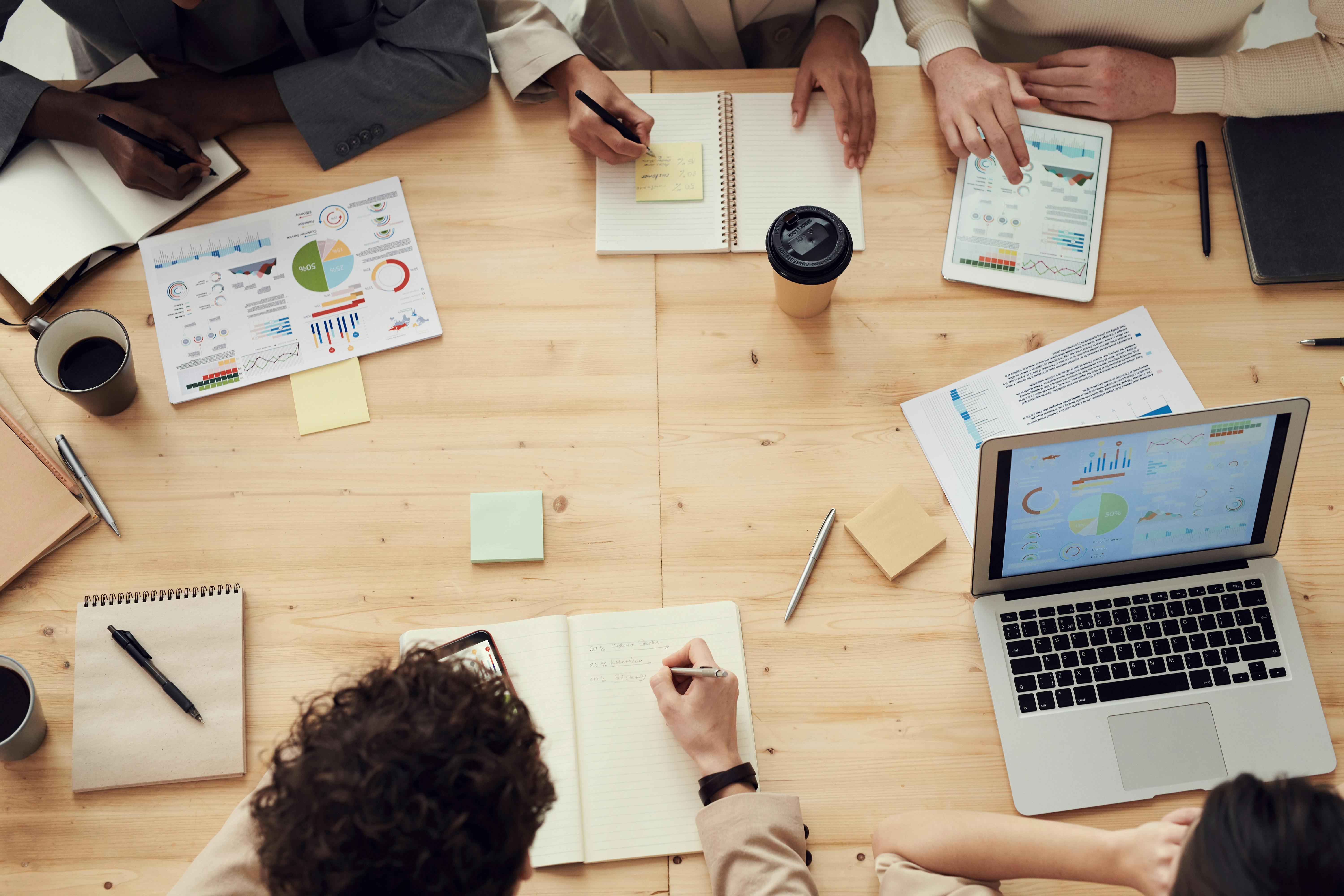 People collaborating around a digital operations plan